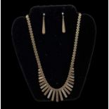 A 9ct yellow, white and rose gold organ pipe necklace, length 50cm, with matching pair of 9ct