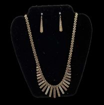 A 9ct yellow, white and rose gold organ pipe necklace, length 50cm, with matching pair of 9ct