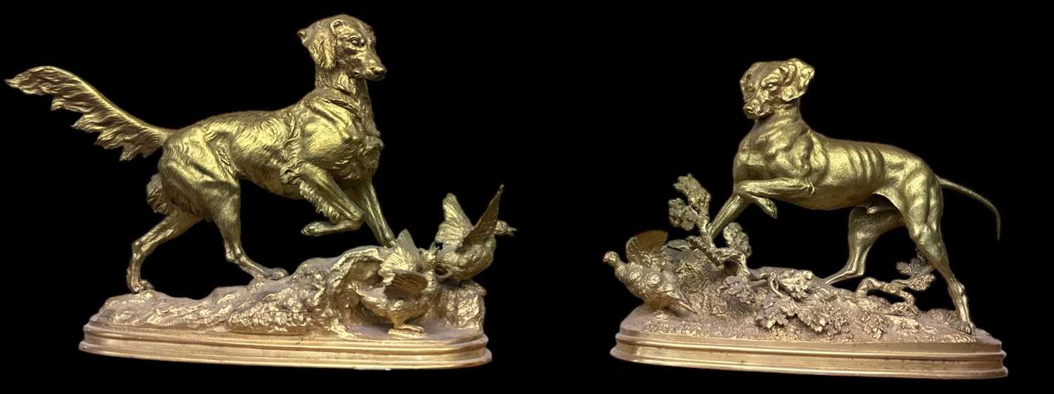 F. J. PAUTROT; a pair of French 19th century gilt bronze models of dogs chasing birds, height 22cm.