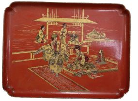 A Japanese red lacquer tray depicting a lady and gentleman sitting on a carpet, 33 x 25cm.