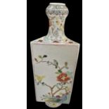 An early 20th century Chinese triangular form vase decorated with birds and flowers amongst trees,