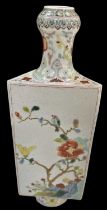 An early 20th century Chinese triangular form vase decorated with birds and flowers amongst trees,