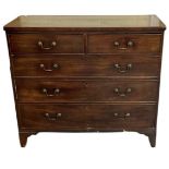 A 19th century mahogany chest of two short over three long drawers with brass handles, on bracket