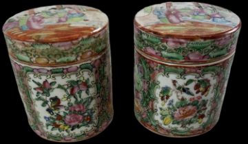 A pair of late 19th century Chinese Canton Famille Rose porcelain hand painted lidded jars, height