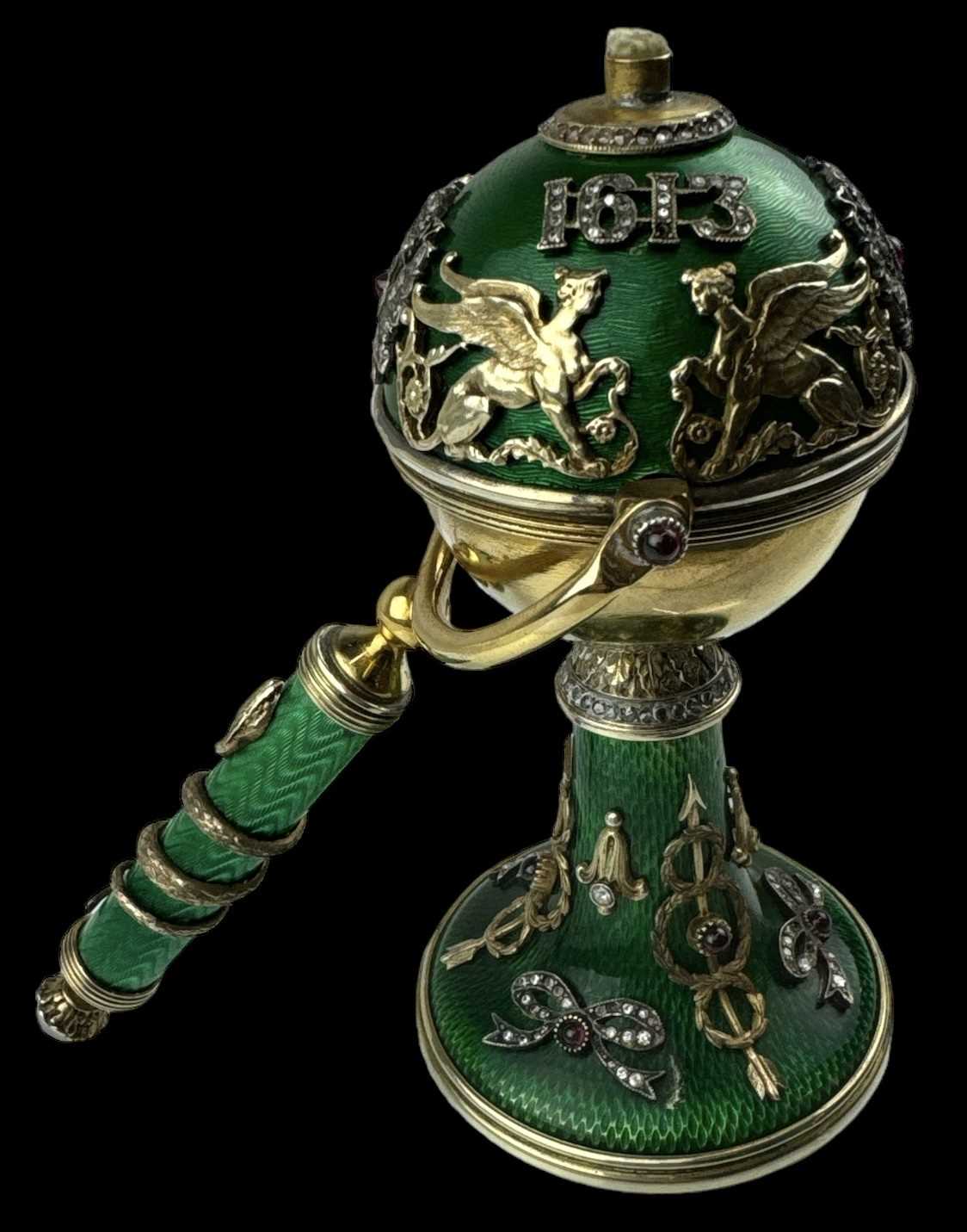 A Russian silver gilt green enamel and jewelled table lighter made to commemorate the Romanov