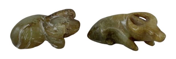 Two Chinese carved hardstone models of buffalos, height 2cm, length 5.5cm (one with drill hole to