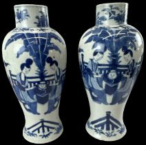 A pair of Chinese blue and white porcelain vases decorated with figures, four character mark to