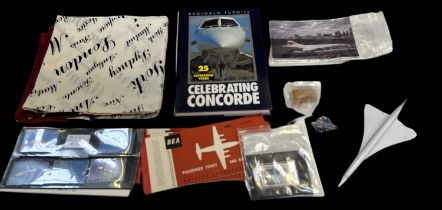A group of Concorde related items including a Corgi model of Concorde, a Concorde silk scarf,