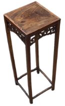 A Chinese hardwood stand, height 56cm, top measures 20.5 x 20.5cm.