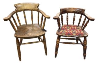 Two smokers' bow back elbow chairs, one with upholstered seat.