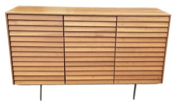 PUNT MOBLES; a mid century light oak veneered sideboard, with three drawers above three cupboard