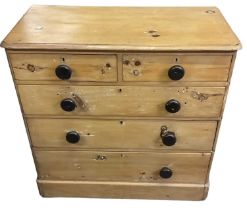 A Victorian pine chest of two short over three long drawers (one handle missing), width 102cm.