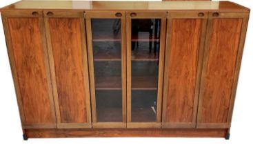 A 1970s rosewood display cabinet with pair of glazed doors flanked by two pairs of cupboard doors,