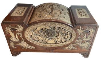 A modern Chinese carved hardwood coffer, with hinged lid, width 93cm, depth 46cm, height 52cm.