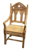 A modern light oak Gothic style Aesthetic Movement elbow chair.