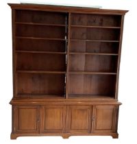 A large late 19th century mahogany bookcase, with an arrangement of four fixed shelves above two