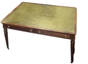 A reproduction mahogany Regency style writing table, with gilt tooled leather inset top above two