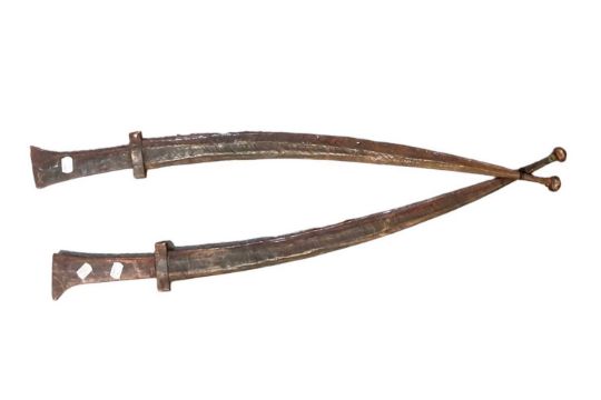 A pair of Tuareg swords in elaborate leather scabbards, each case fitted with smaller dagger, length - Image 1 of 2