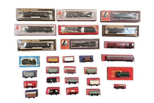 A collection of boxed OO rolling stock and engines including three Mainline Railways wagons, three