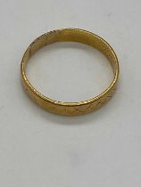 A 22ct yellow gold wedding band, London 1968, size S 1/2, approx 3.3g.
