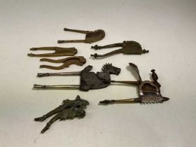 A collection of decorative betel nut cutters (7).