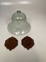 A vintage glass bell cloche, height 28cm and a pair of iron clock faces, width 16cm.