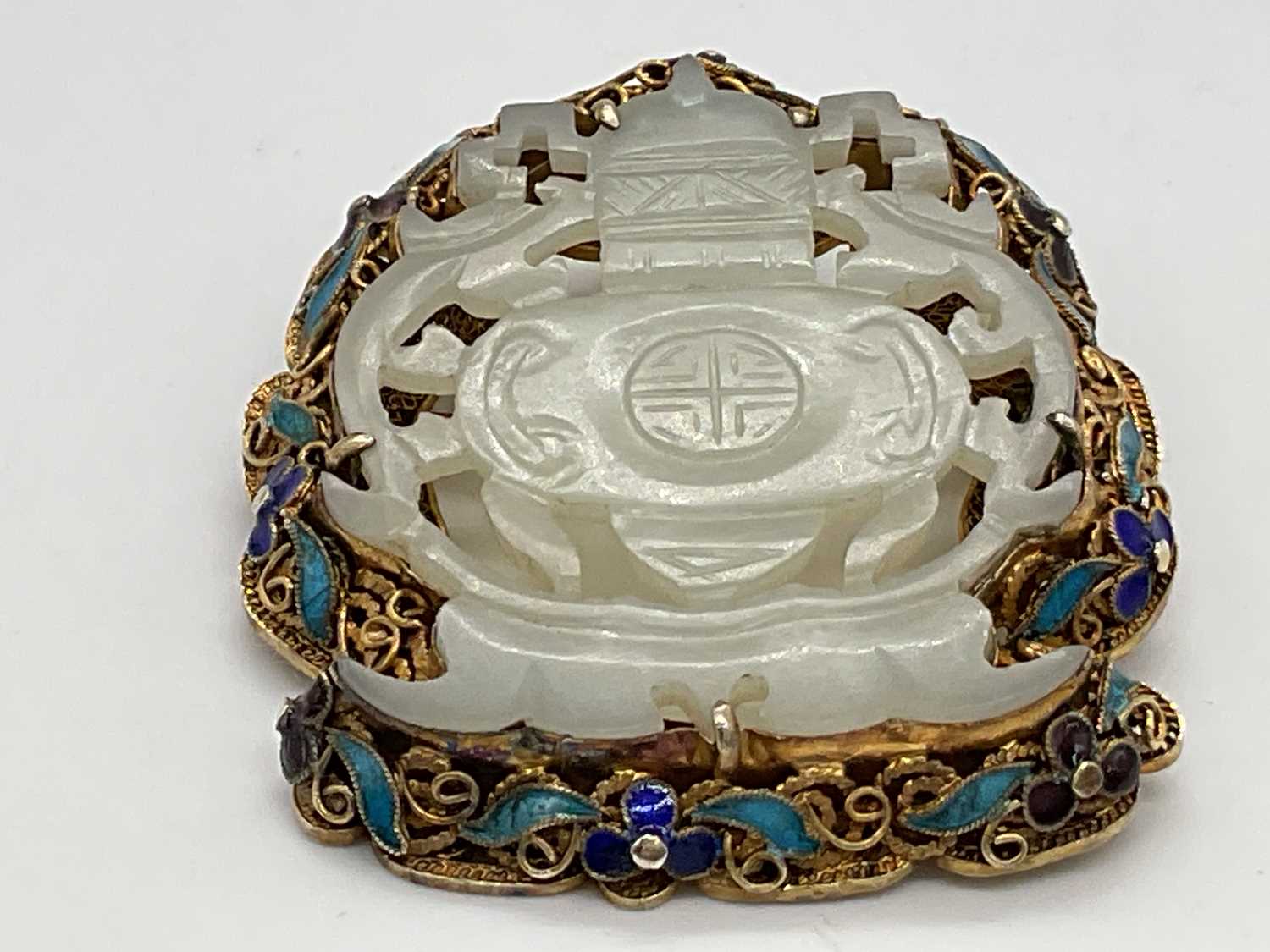 A Chinese pale jade plaque brooch in silver gilt and enamelled frame, 52 x 45mm. - Image 2 of 4