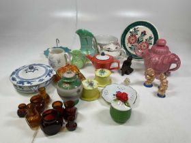 A collection of ceramics and glass jars including Beswick, Sadler, Woods, Wade, Burleigh and