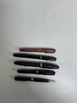 Four Waterman fountain pens including a 512V with a 14ct gold nib and engraved 'W2A' in black,