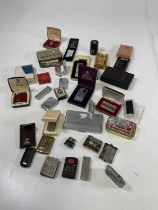 A group of vintage lighters including a 1950s Sankyo 'Price Newsletter Musical Lighter', various