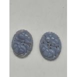 An unusual pair of floral carved chalcedony plaques, 37 x 27mm.