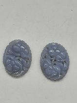 An unusual pair of floral carved chalcedony plaques, 37 x 27mm.