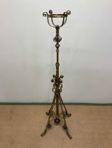 A late Victorian adjustable brass standard lamp, height 160cm.
