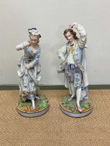 A pair of Armand Marseille porcelain figurines, height 39cm.