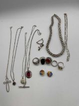 A group of silver and white metal, including a thick open work chain, dress rings, pendants etc.