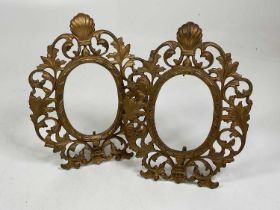 A pair of late 19th/early 20th century gilt brass Rococo photo frames with easel backs, height