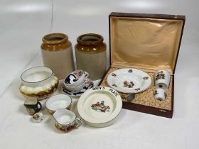 An assortment of ceramics including Royal Doulton, stoneware jars, baby plate and a boxed child's