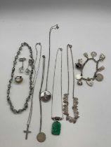 A quantity of silver and white metal jewellery, including charm bracelet, Art Deco inspired