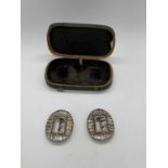 A pair of George III paste set shoe buckles, with yellow metal detail to the frame, and presented in