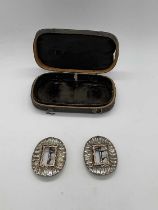 A pair of George III paste set shoe buckles, with yellow metal detail to the frame, and presented in