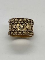 A 9ct yellow gold broad oval ring, size L, approx 8.1g.