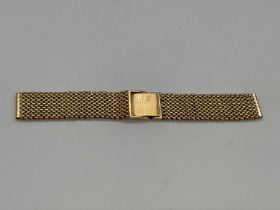 A yellow metal watch strap with simple clasp, stamped 18k, length 14cm, approx 40.3g.