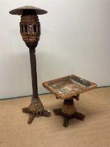 A rustic wooden floor lamp and coffee table constructed from a cart wheel, lamp height 150cm.