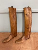 A pair of vintage wooden boot trees.