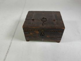 A carved oak wooden safe box with metal hinges, locks and securing ring, height 16cm, width 30cm,