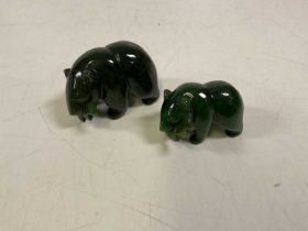 Two nephrite jade ornaments of brown bears catching Salmon.