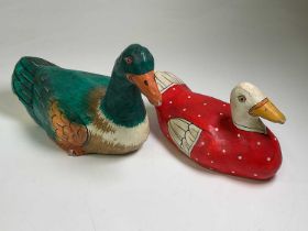 Two hand painted papier-mâché decoy ducks, largest length 38cm.