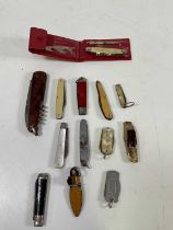 A mother of pearl silver blade pocket knife and a small group of further pocket knives.