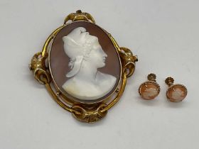 A large Victorian yellow metal framed cameo brooch, 72mm and a pair of 9ct yellow gold screw back