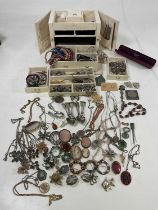 A quantity of costume jewellery together with plated spoons, a silver baby spoon and push, etc.